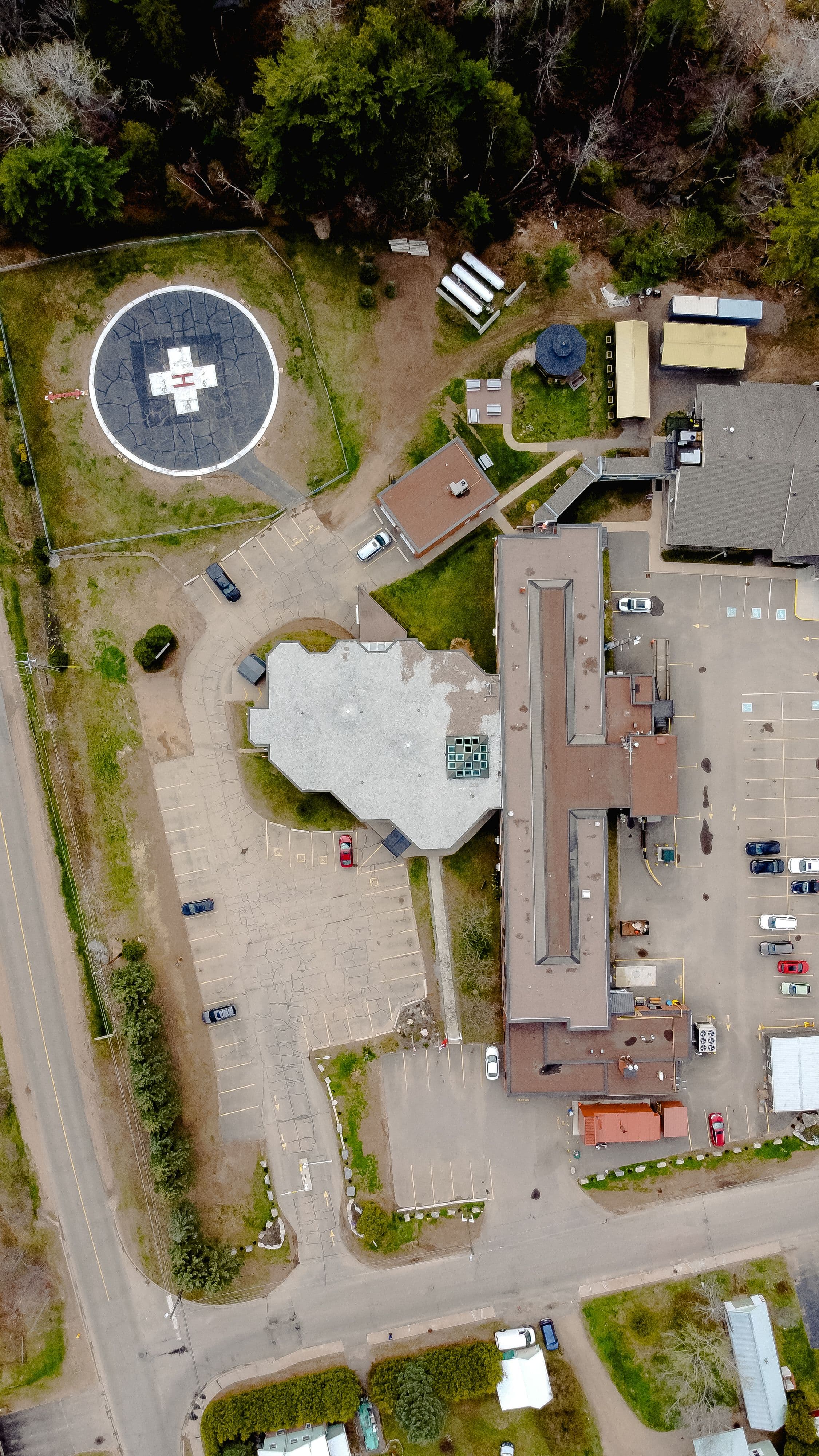Aerial view of a medical facility and helipad