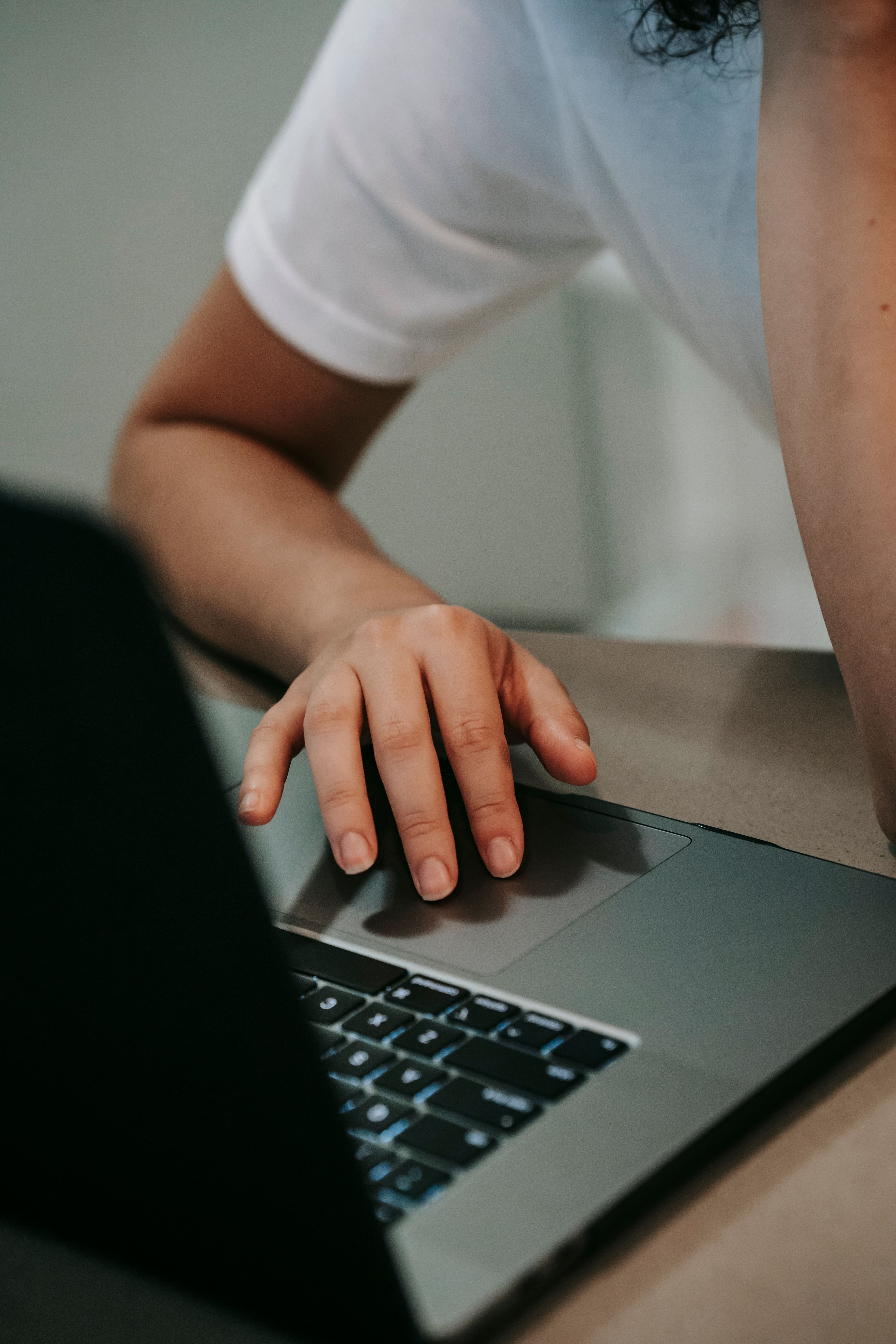 Professional using a laptop during project coordination work