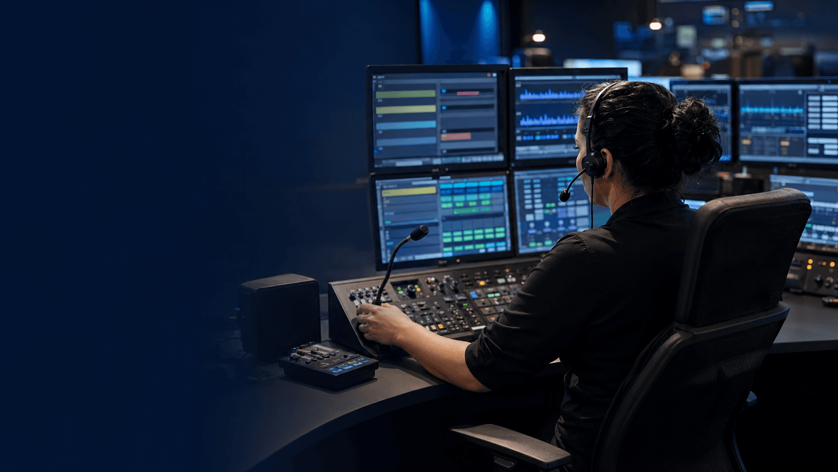 Public safety telecommunicator operating a two-way radio dispatch console